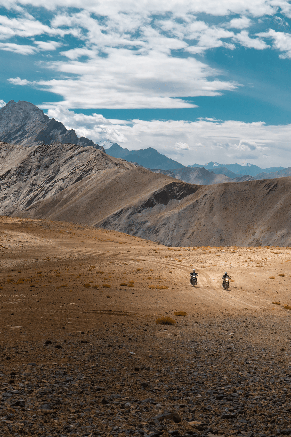 two adventure motorcycles on rugged terrain in ladakh